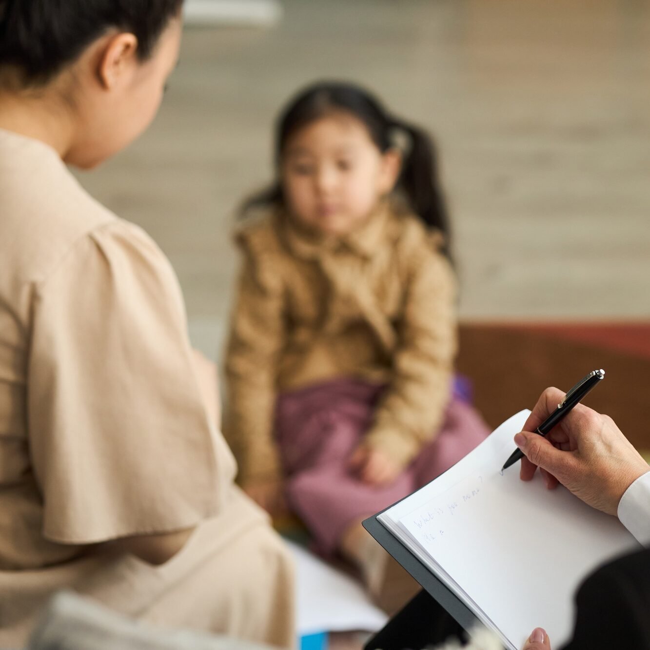 Women Discussing Childs Progress in Kindergarten Education
